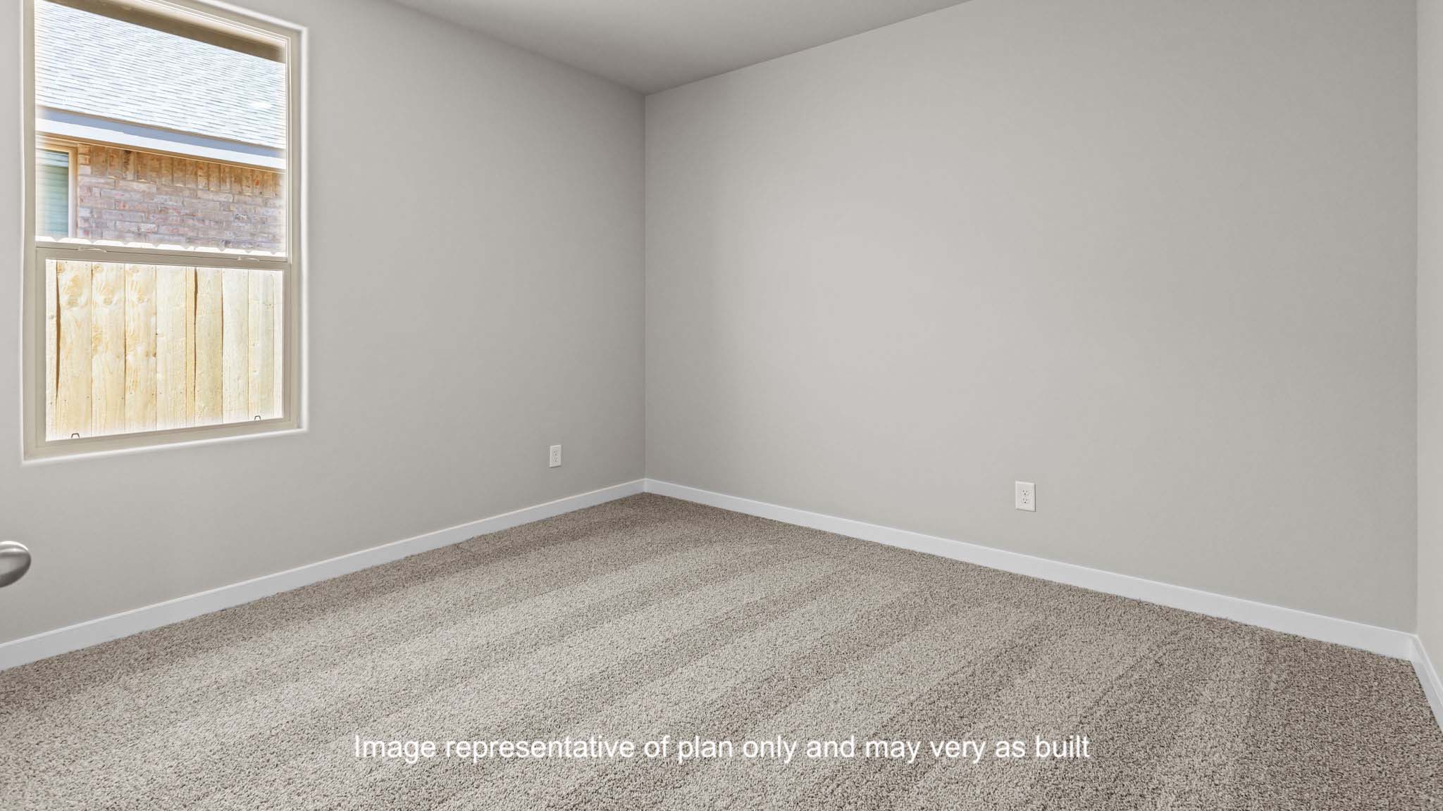 Guest bedroom 2 with side window and plush carpet floor