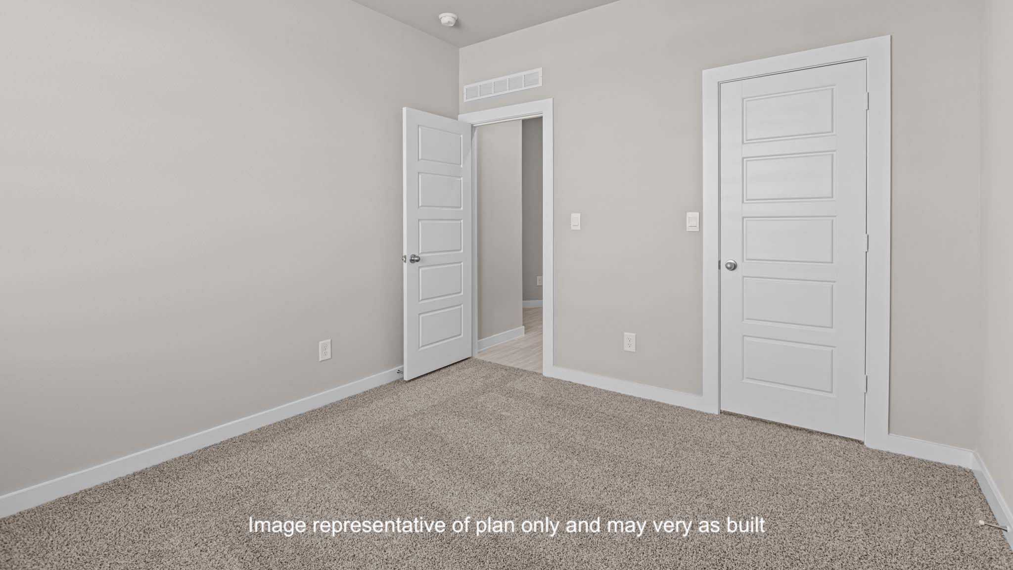 Bedroom 1 with spacious closet and plush carpet floors