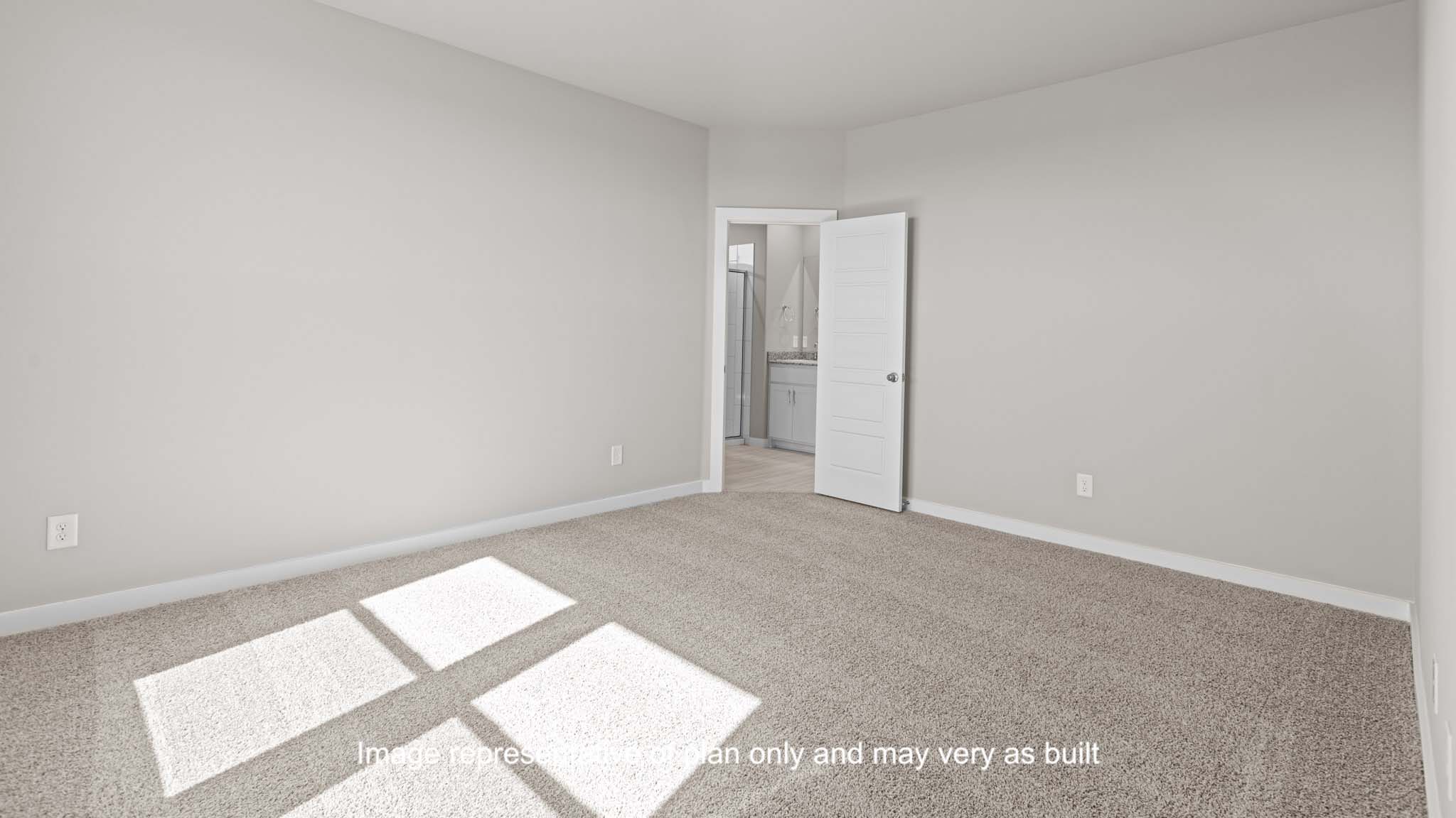 Primary bedroom with attached private bathroom and spacious walk in closet
