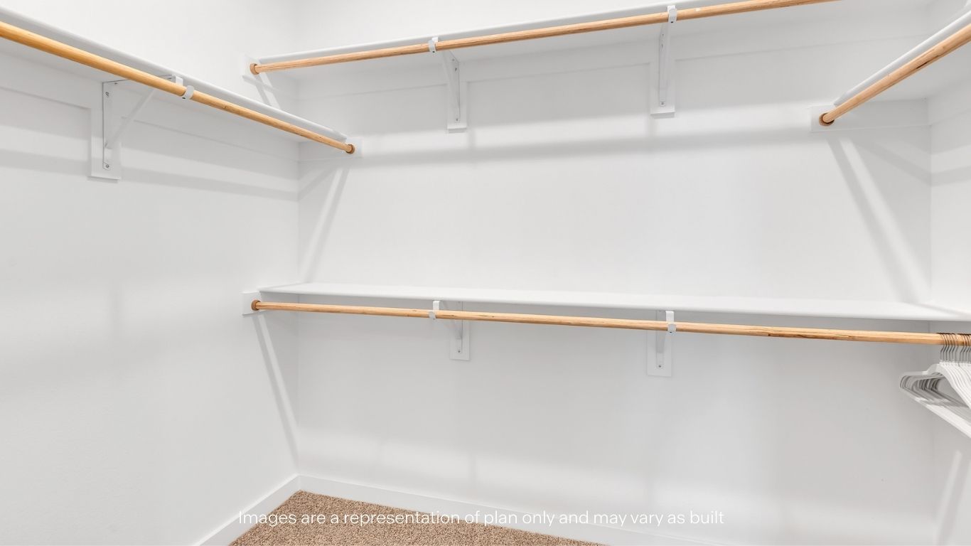 Primary walk-in closet with extra storage space