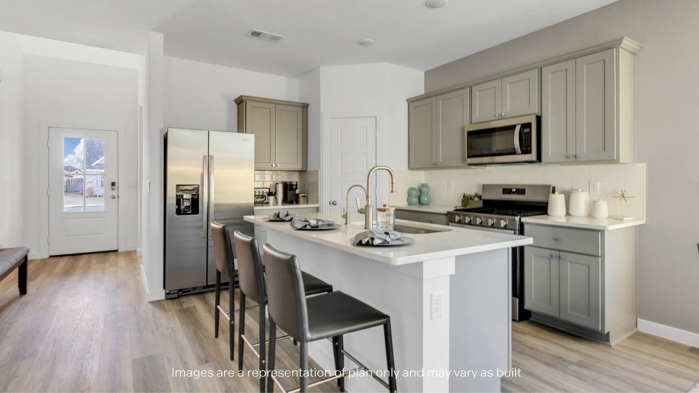 Spacious open concept kitchen with island and counter prep space
