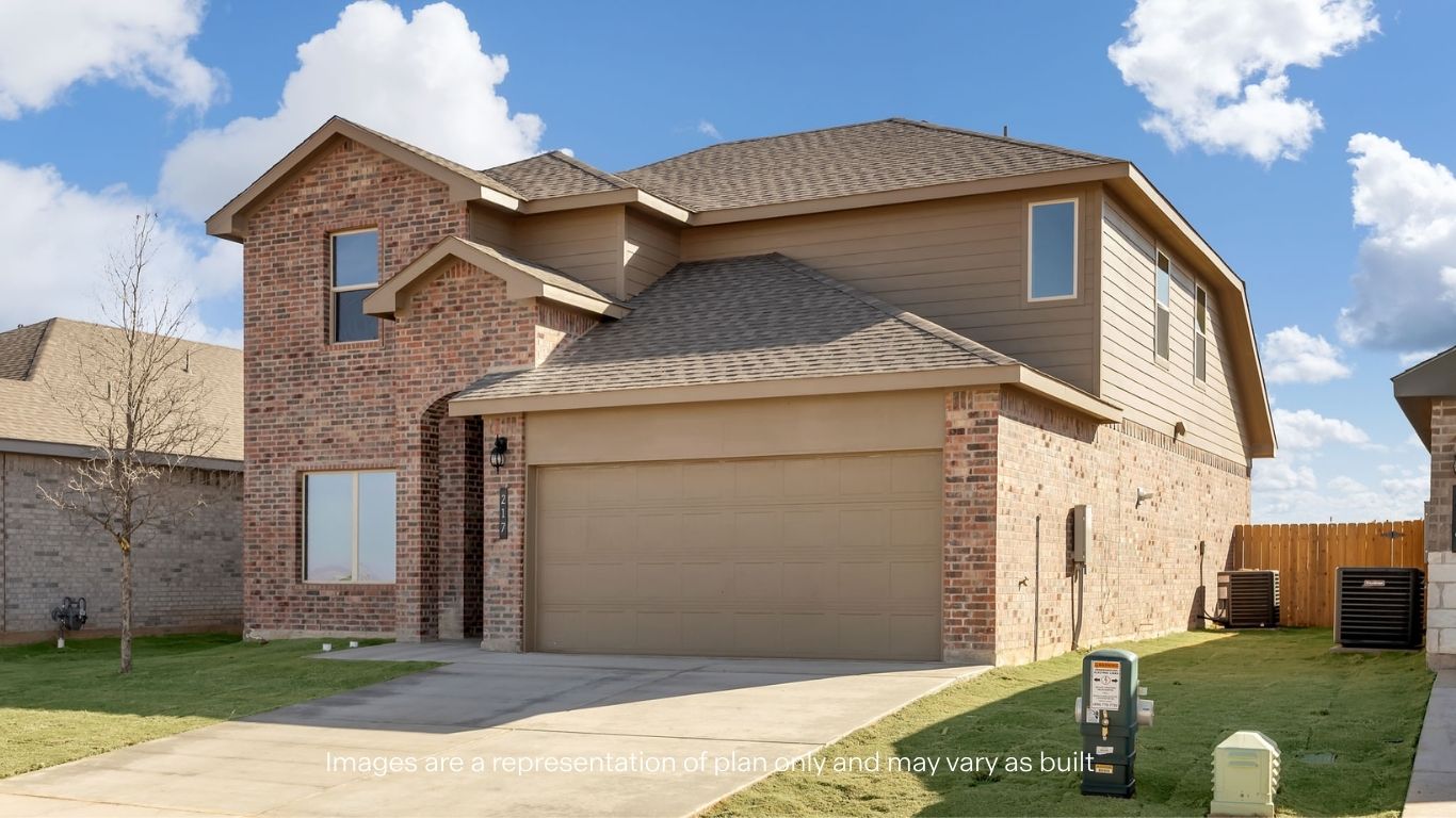 Side view of two story timeless brick home