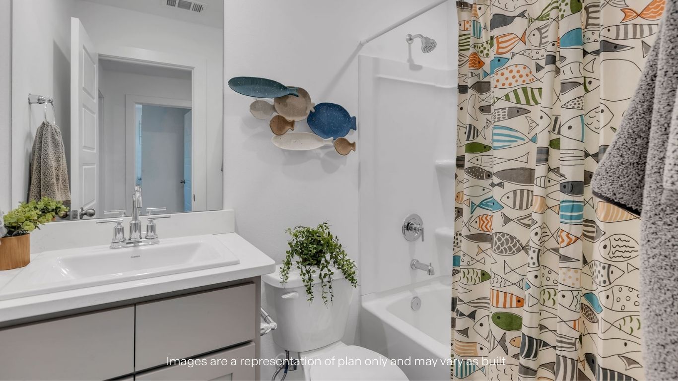Guest bathroom with built in vanity and combination bathtub shower