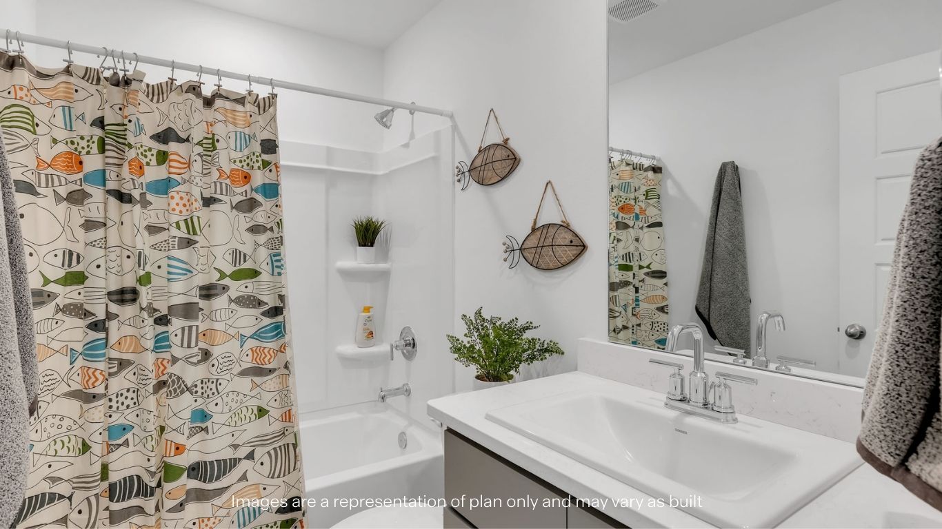 Guest bathroom with built in vanity and combination bathtub shower