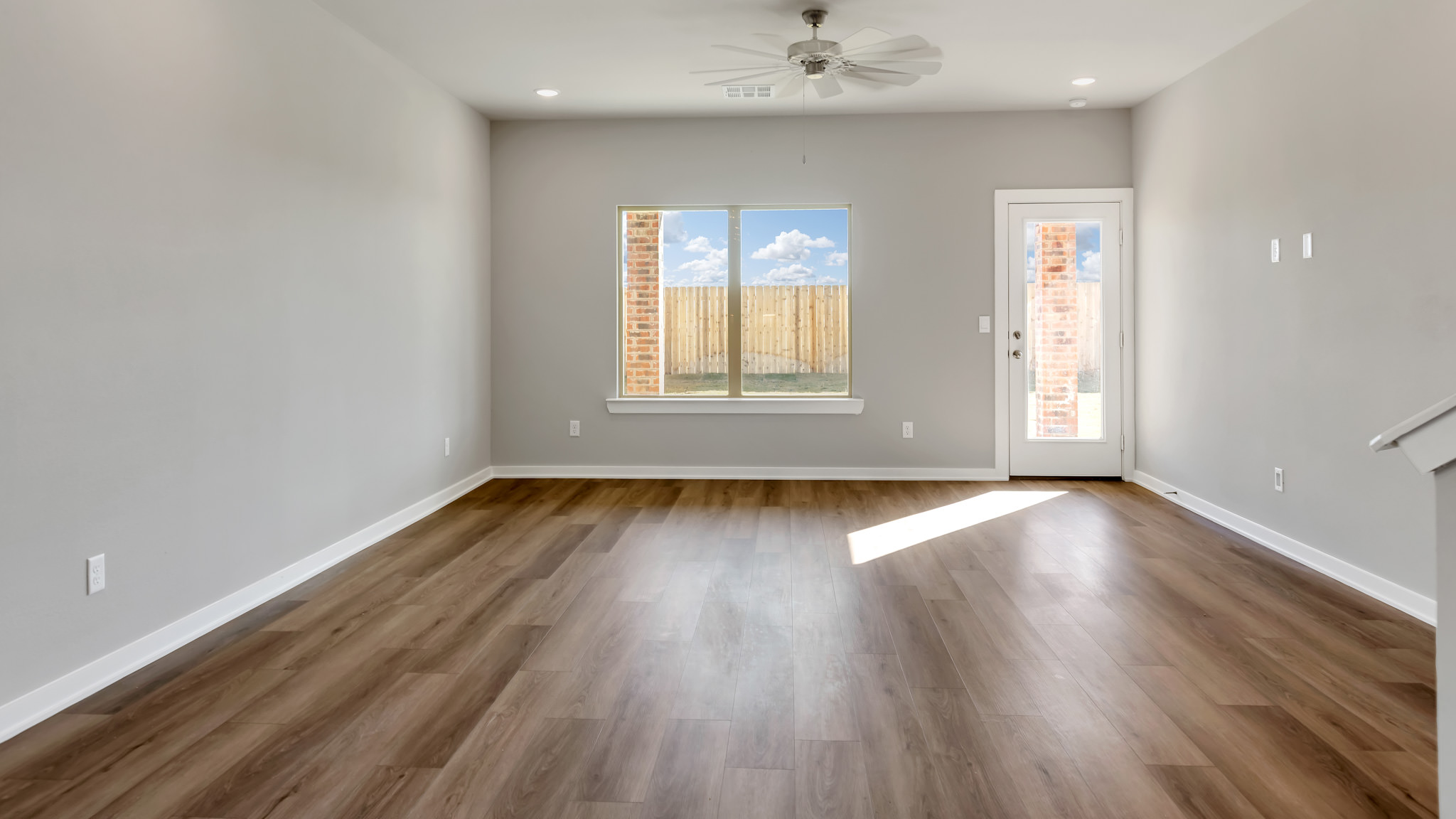 Open living and family room area with ample natural light