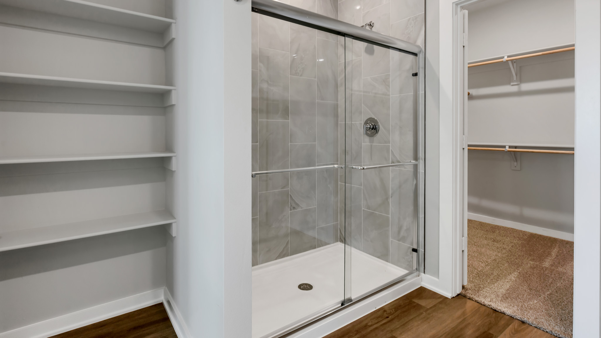Primary bathroom with luxurious shower and built in storage