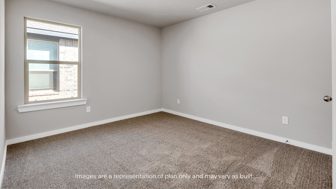 Guest bedroom 2 with side window and plush carpet floor