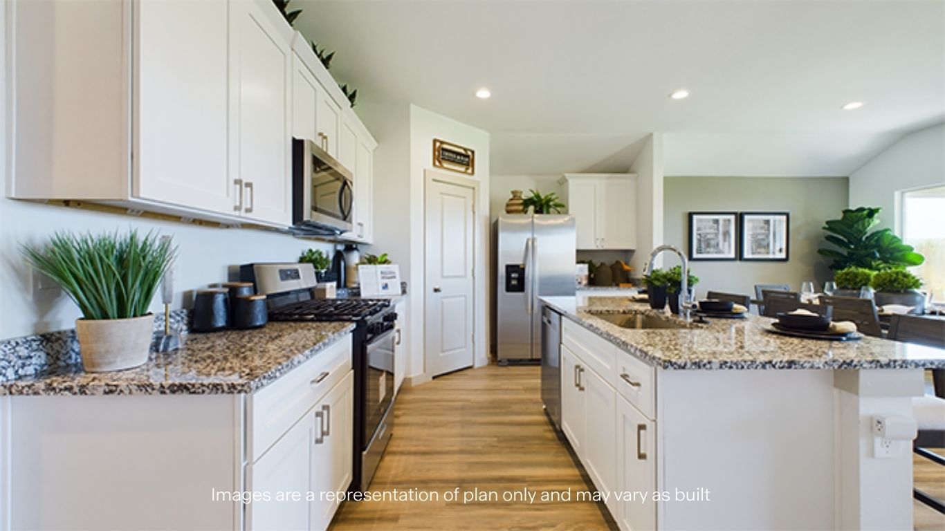Open concept kitchen with stainless steel appliances, shaker style cabinets, and elevated finishes