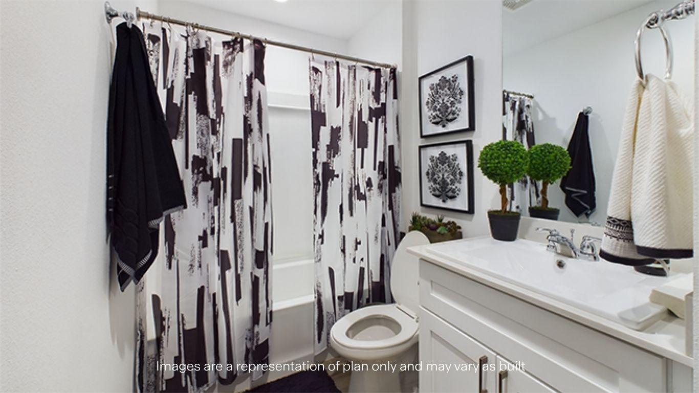 Guest bathroom with built in vanity and combination bathtub shower