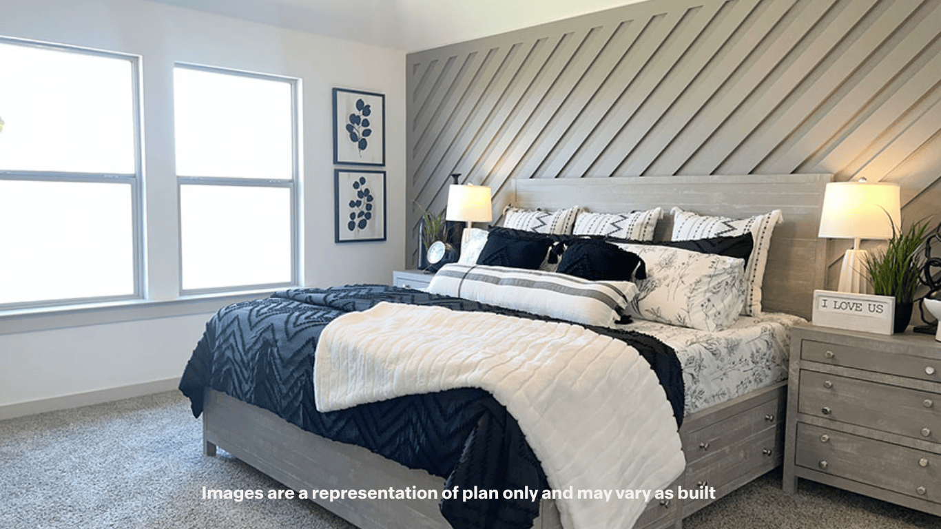 Primary bedroom with plush carpet floors and light allowing double windows