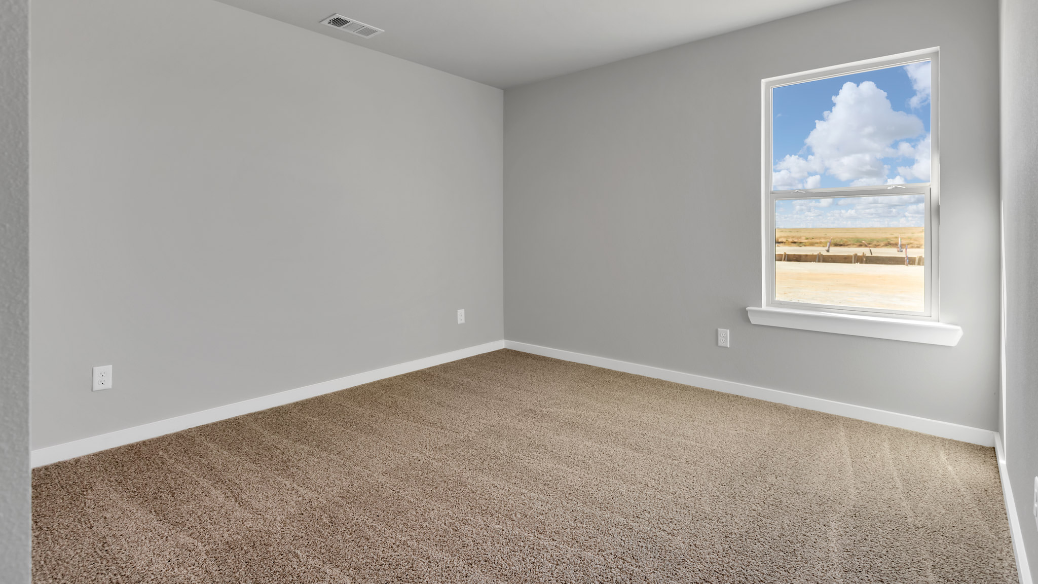Guest bedroom 2 with plush carpet and spacious closet