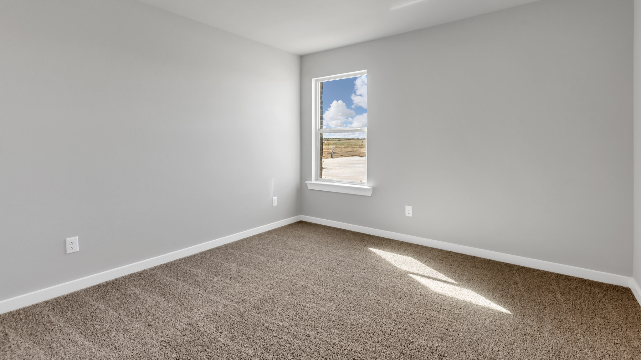 Guest bedroom 3 with side window and plush carpet floor