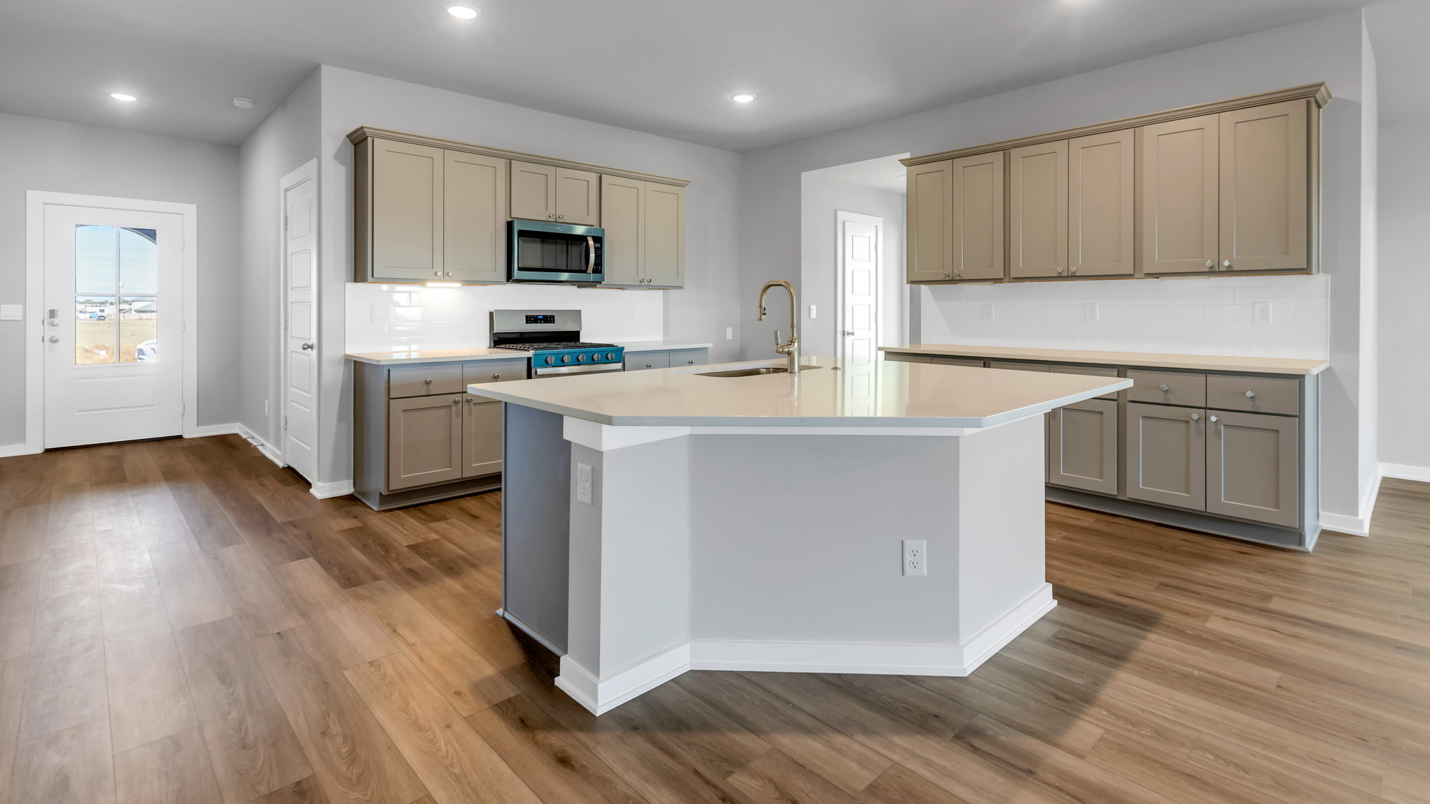 Spacious open concept kitchen with island and counter prep space