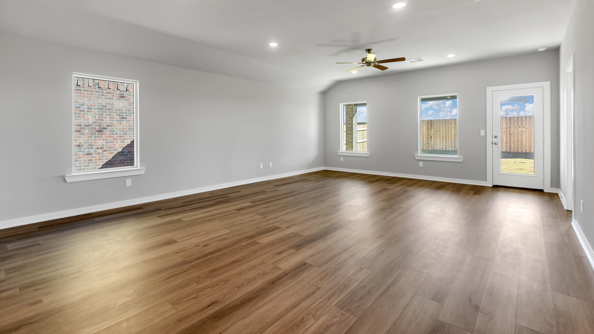 Open living and family room area with ample natural light
