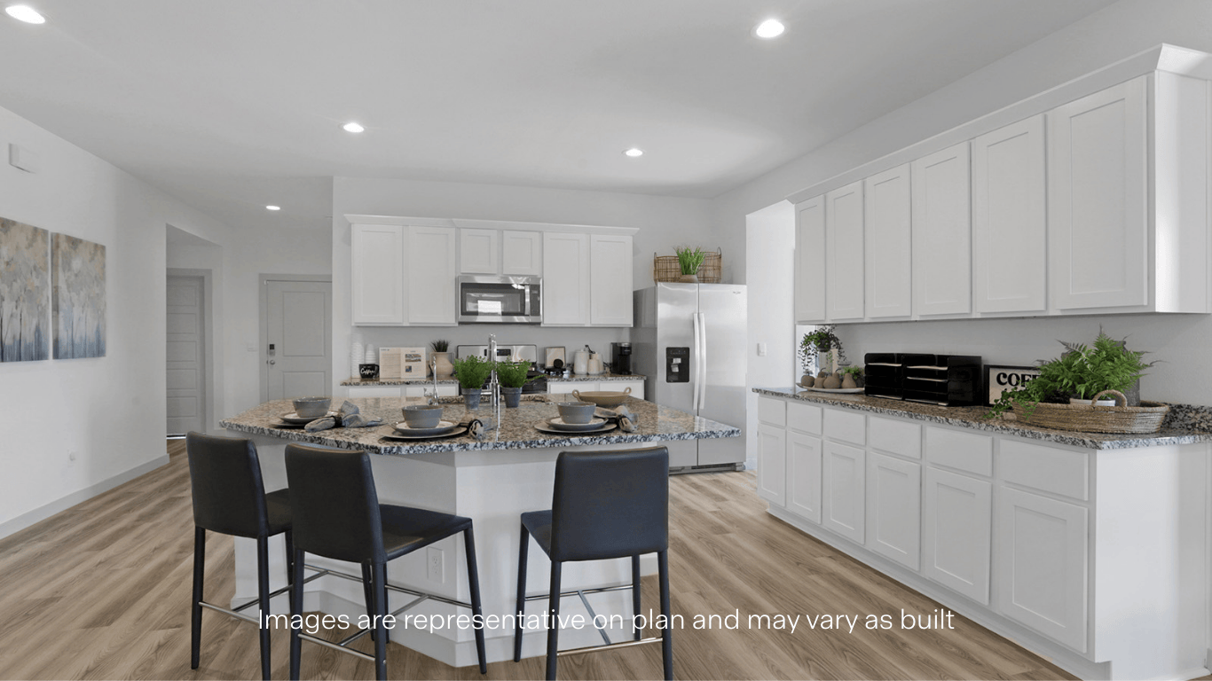 Open concept kitchen with stainless steel appliances, shaker style cabinets, and elevated finishes