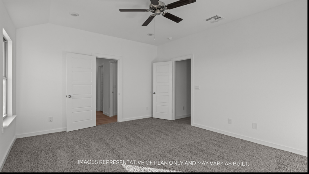 Primary bedroom with private attached bathroom and walk-in closet