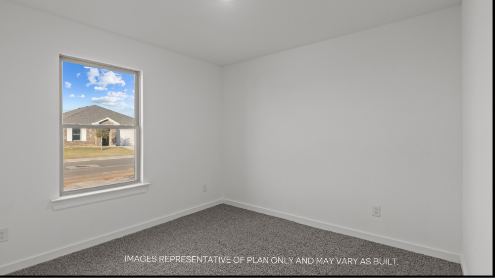 Guest bedroom 1 with front windows and ample natural light