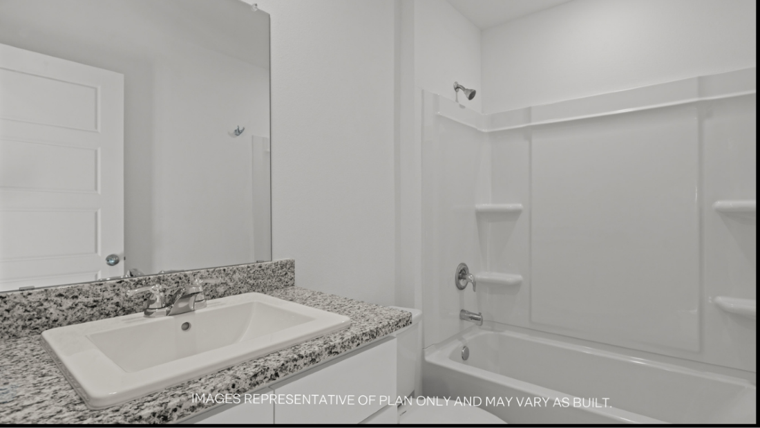 Guest bathroom with built in vanity and combination bathtub shower