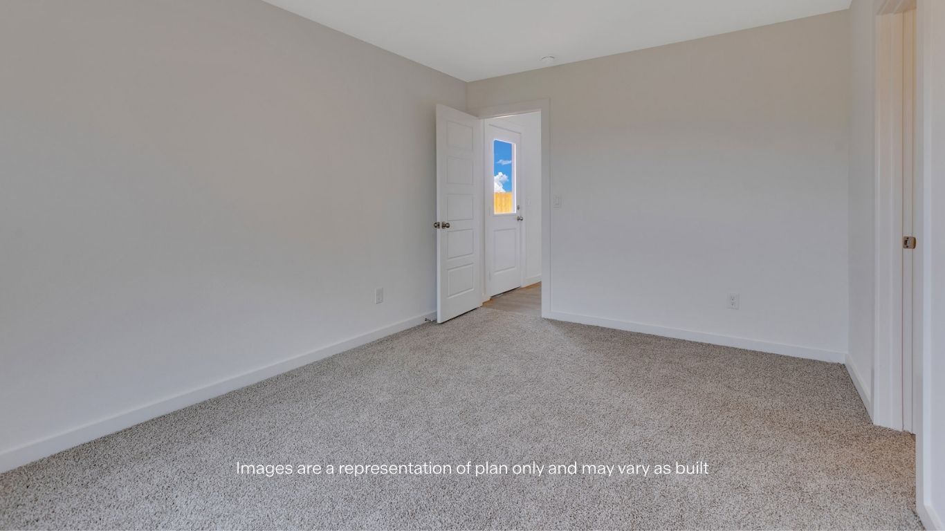 Primary bedroom with private attached bathroom and walk-in closet