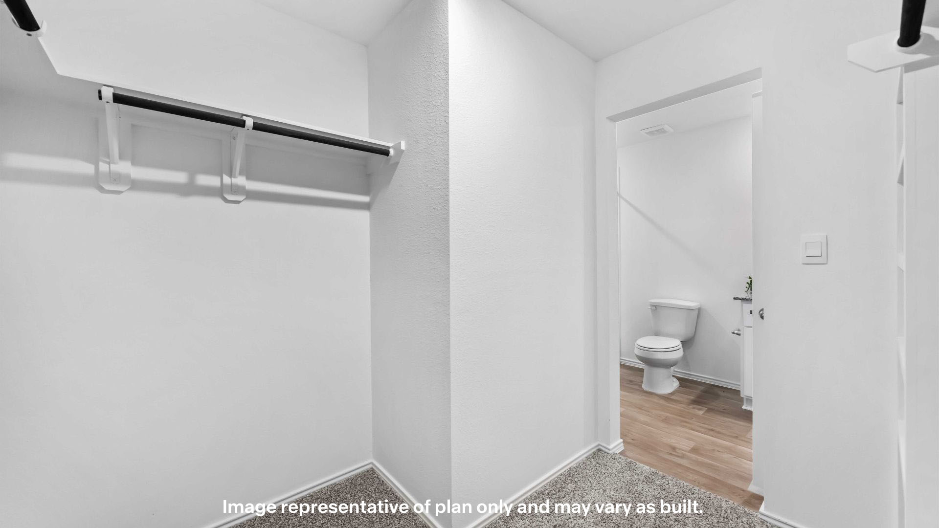 Primary walk-in closet with extra storage space