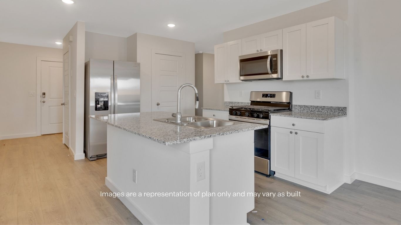 Spacious open concept kitchen with island and counter prep space