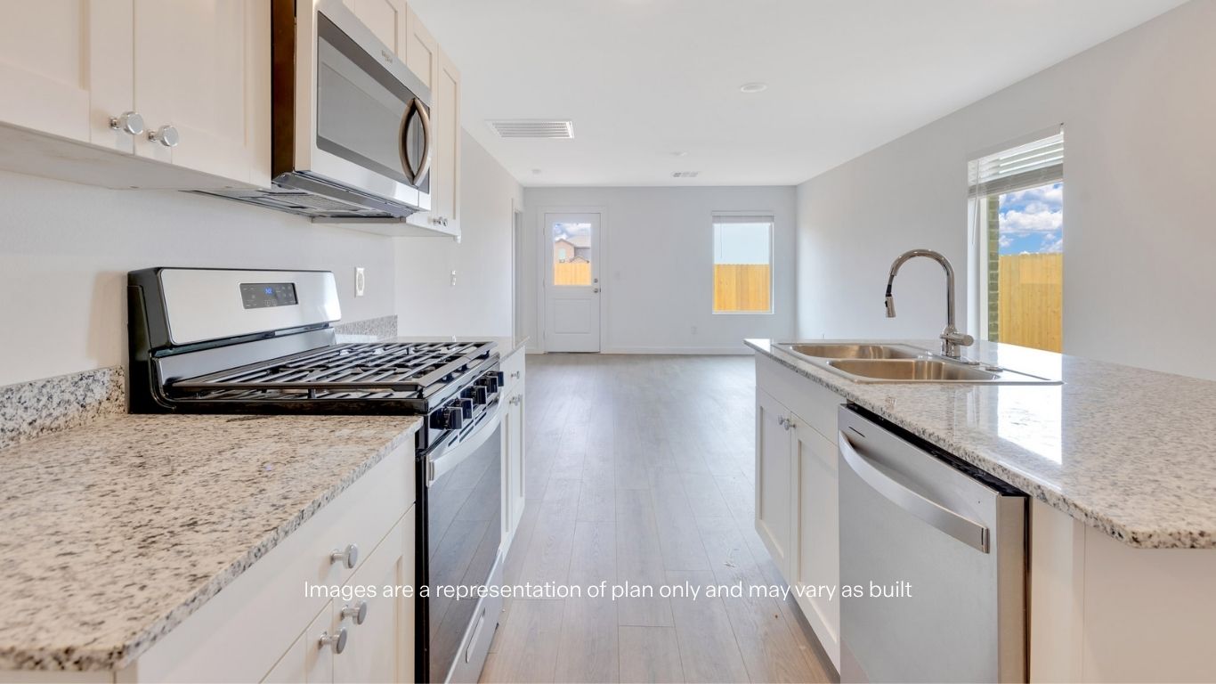 Open concept kitchen with stainless steel appliances, shaker style cabinets, and elevated finishes