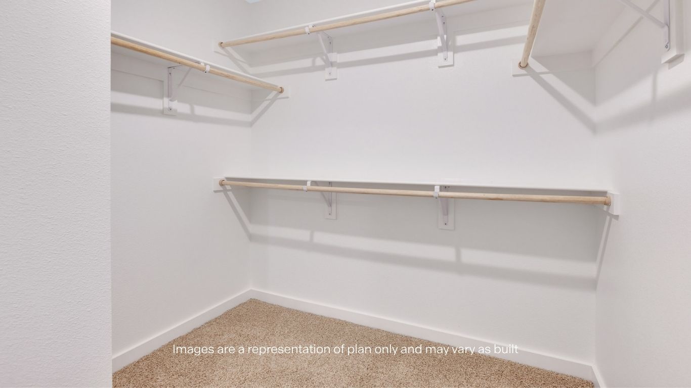 Primary walk-in closet with extra storage space