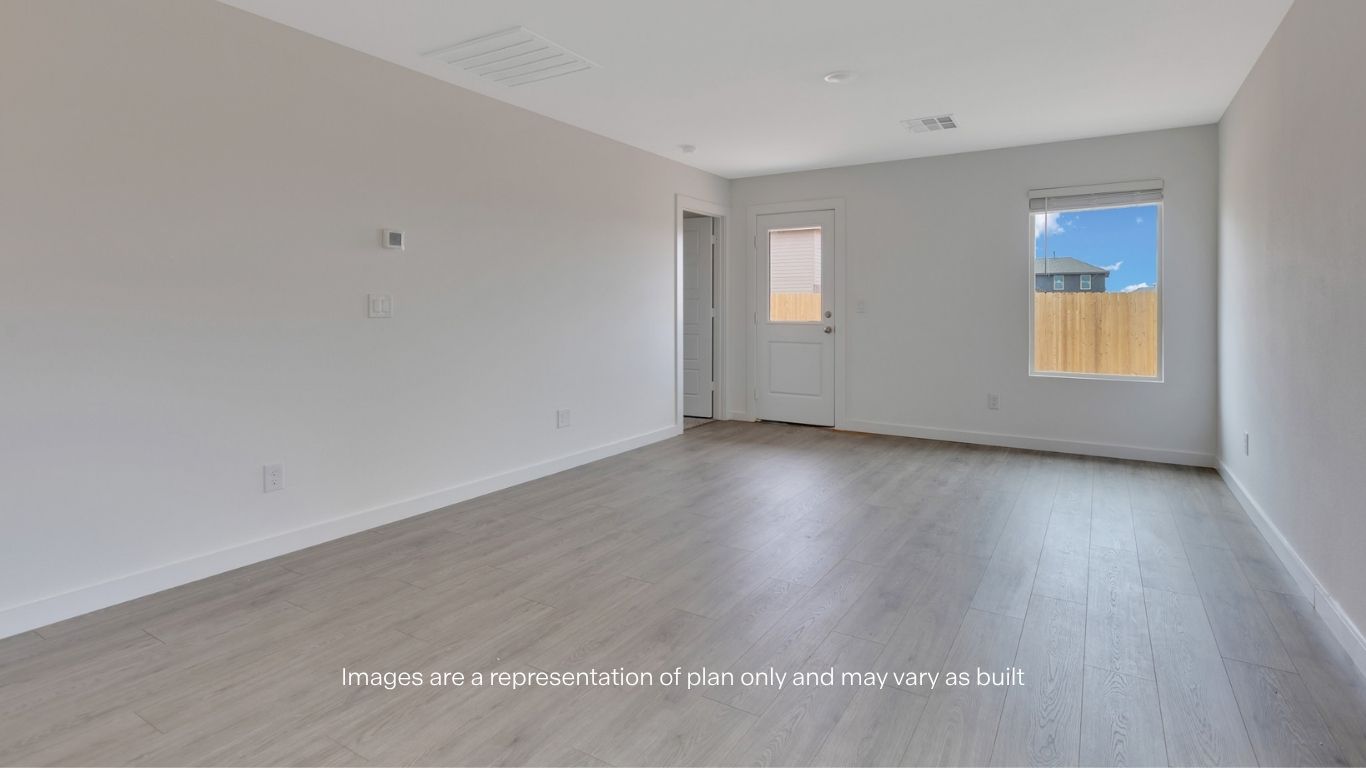 Open living and family room area with ample natural light