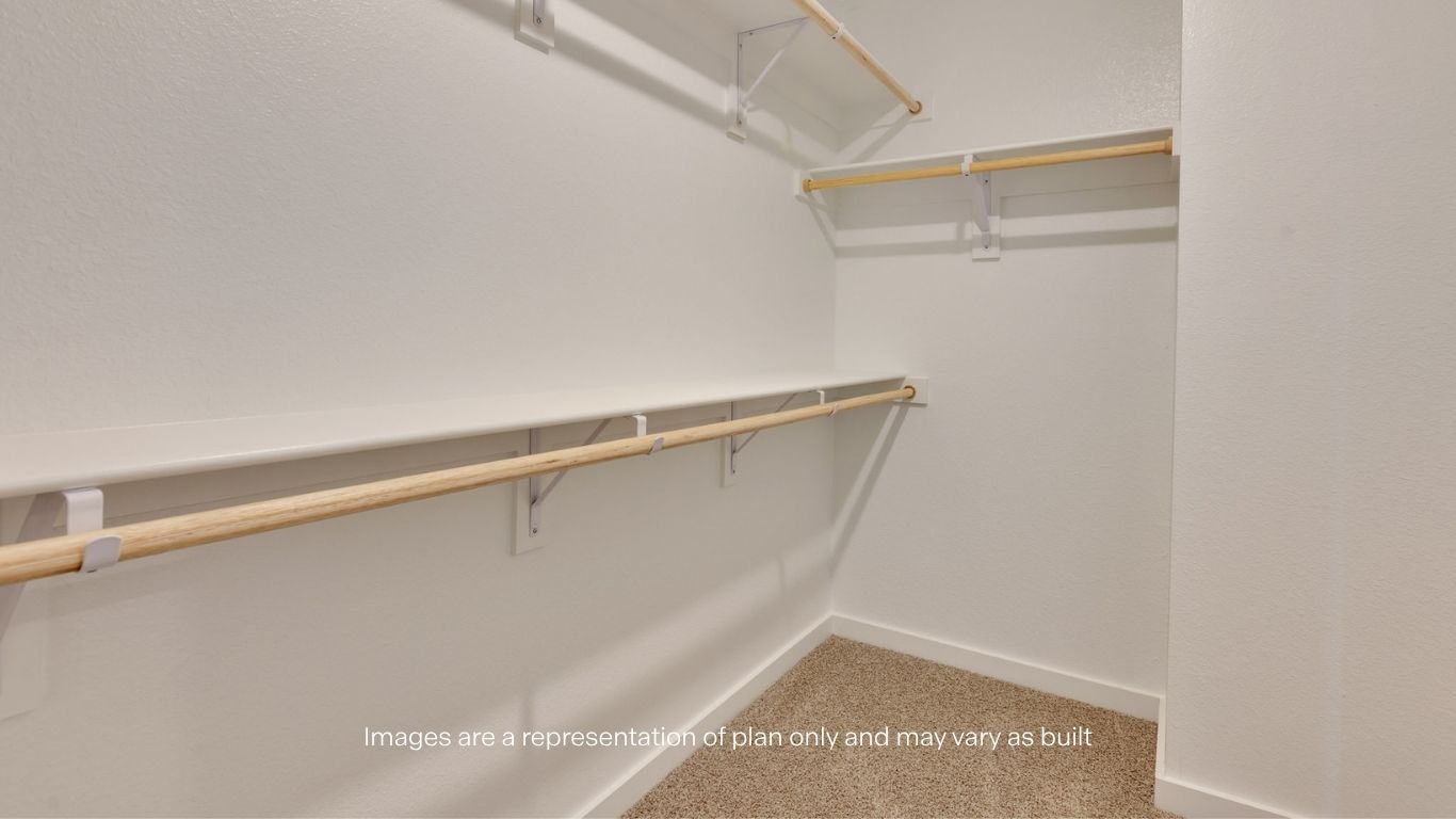 Primary walk-in closet with extra storage space
