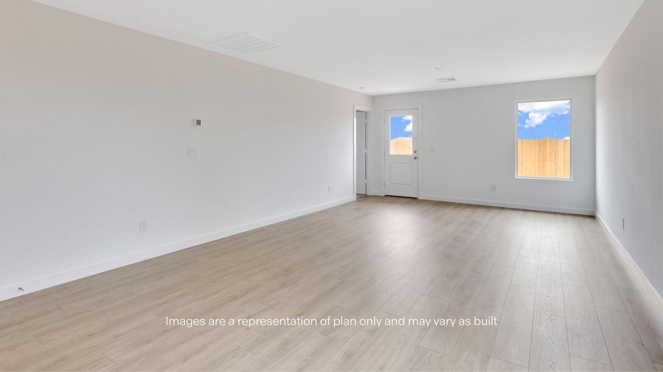 Open living and family room area with ample natural light
