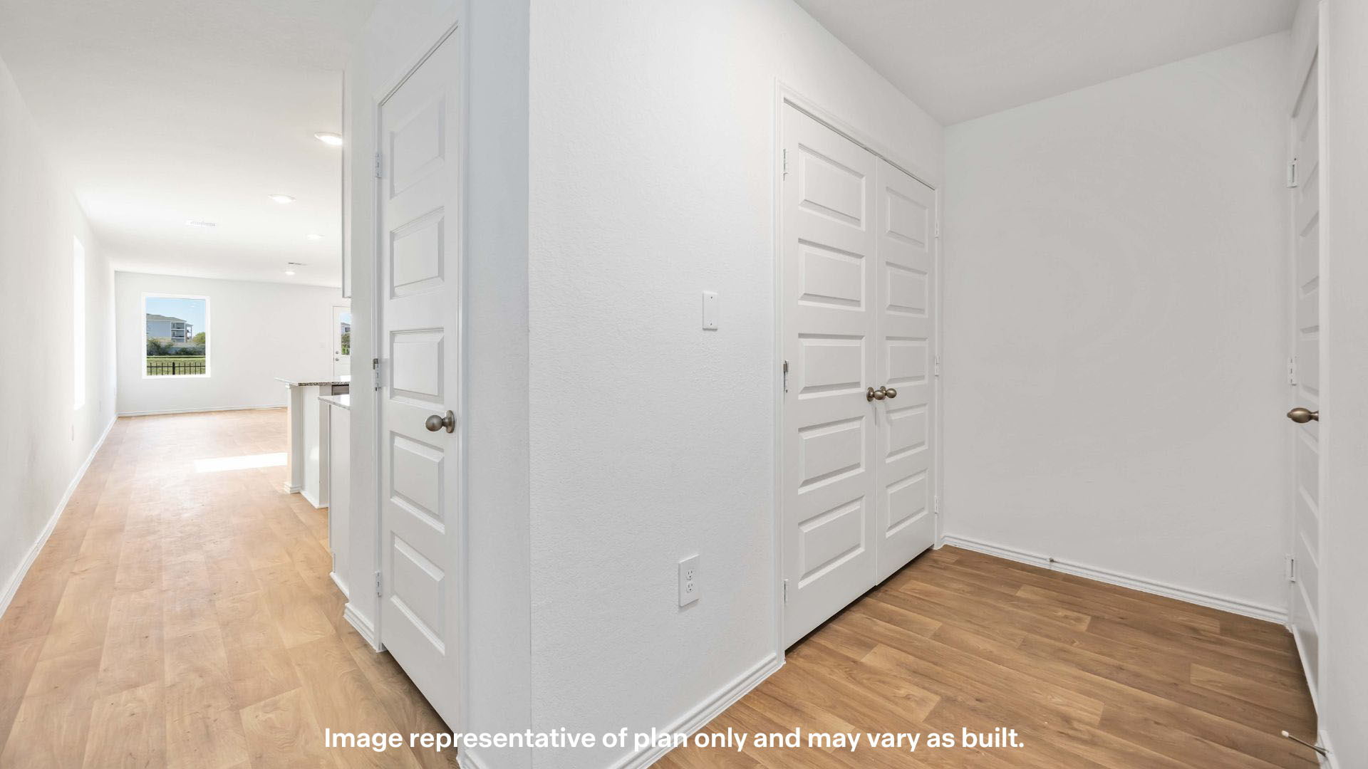 Entrance foyer with coat closet and laundry closet