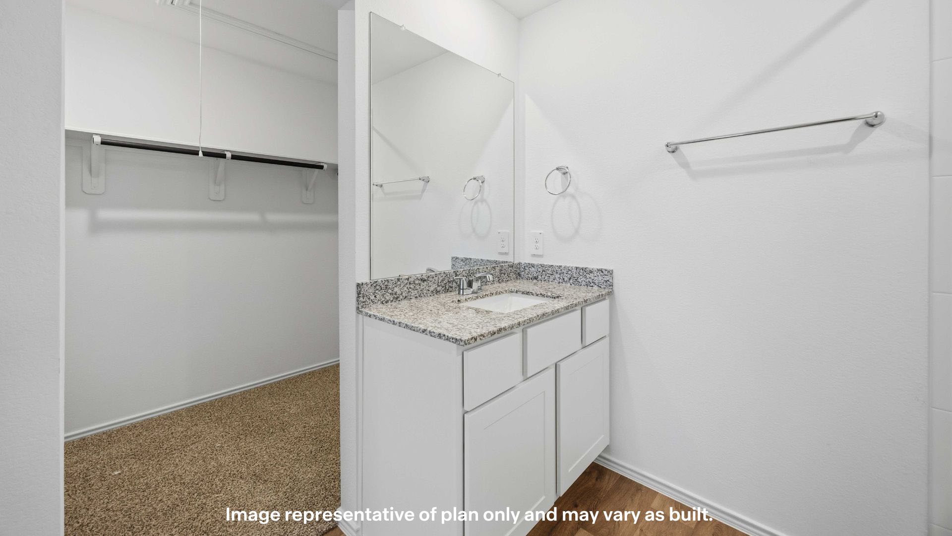 Private attached primary bathroom with built in vanity and luxurious shower