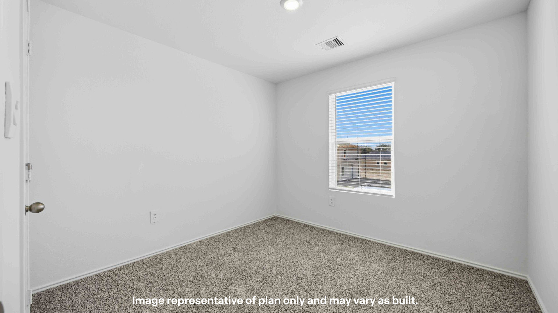 Upstairs guest bedroom with ample light and plush carpet floors