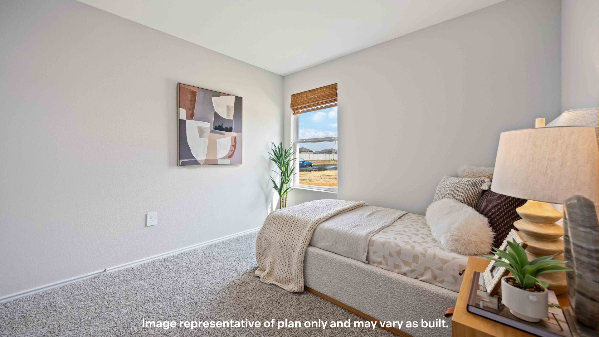 Guest bedroom with side window and plush carpet floor