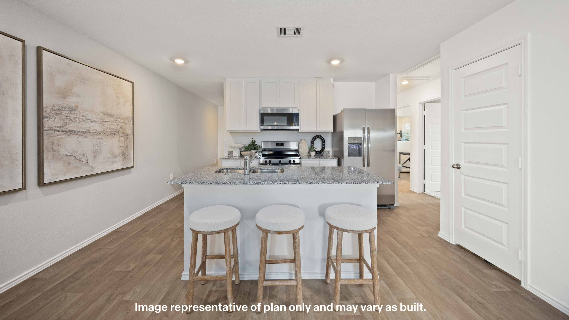 Spacious open concept kitchen with island and counter prep space