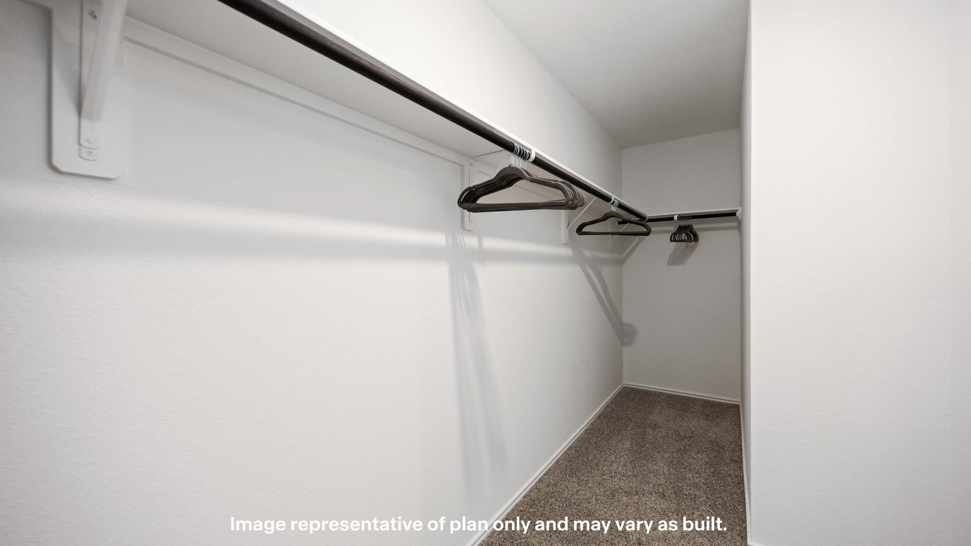 Primary walk-in closet with extra storage space