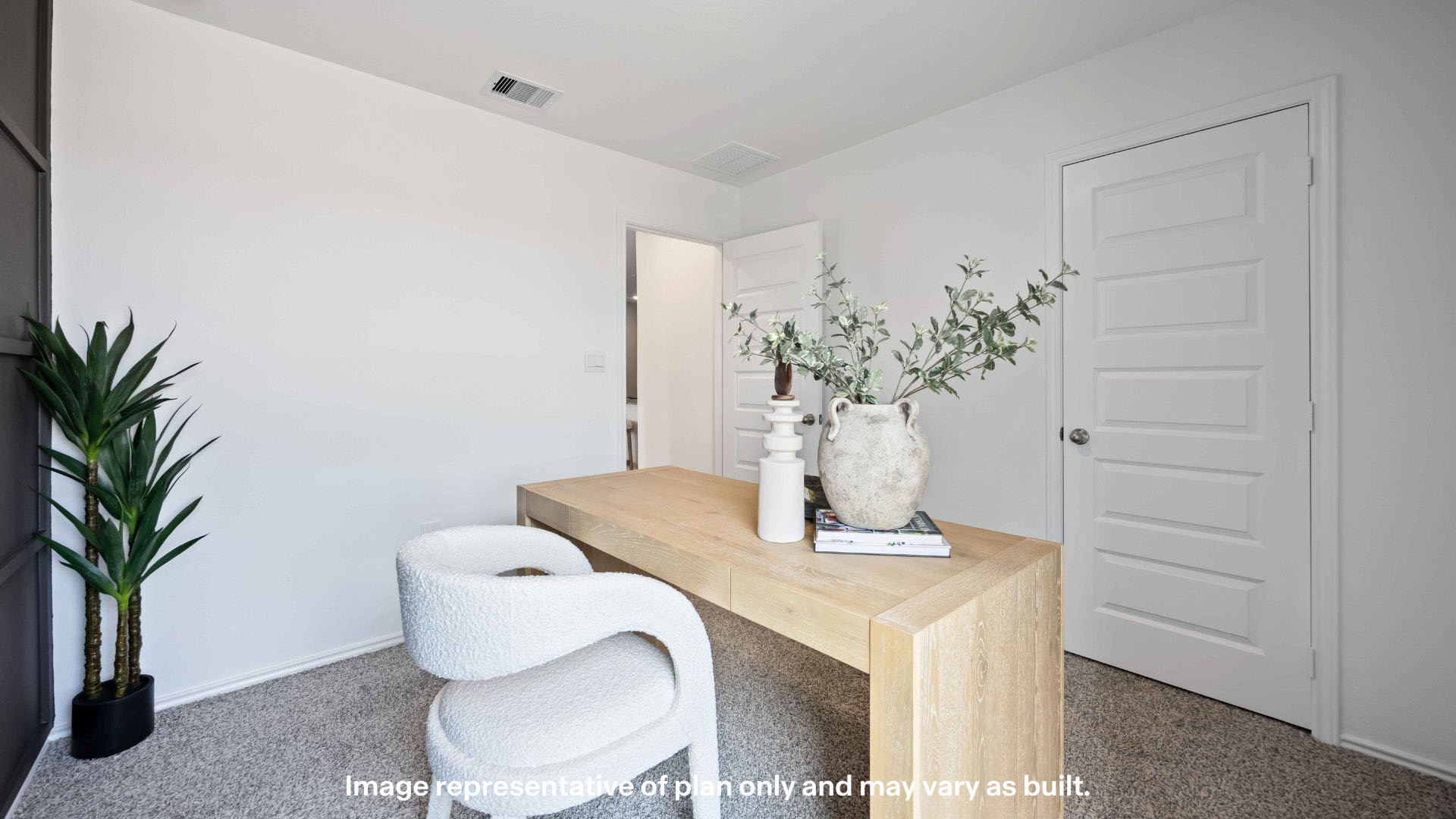 Guest bedroom with plush carpet floors and spacious closet