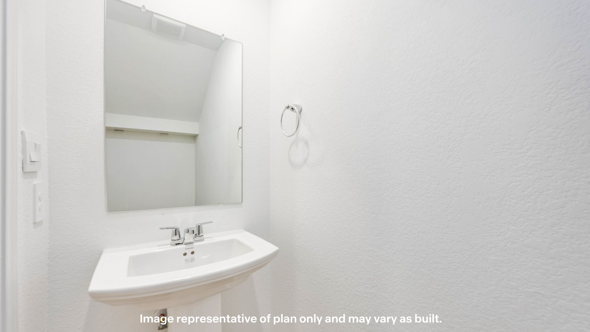 Half bathroom between entrance foyer and dinning area