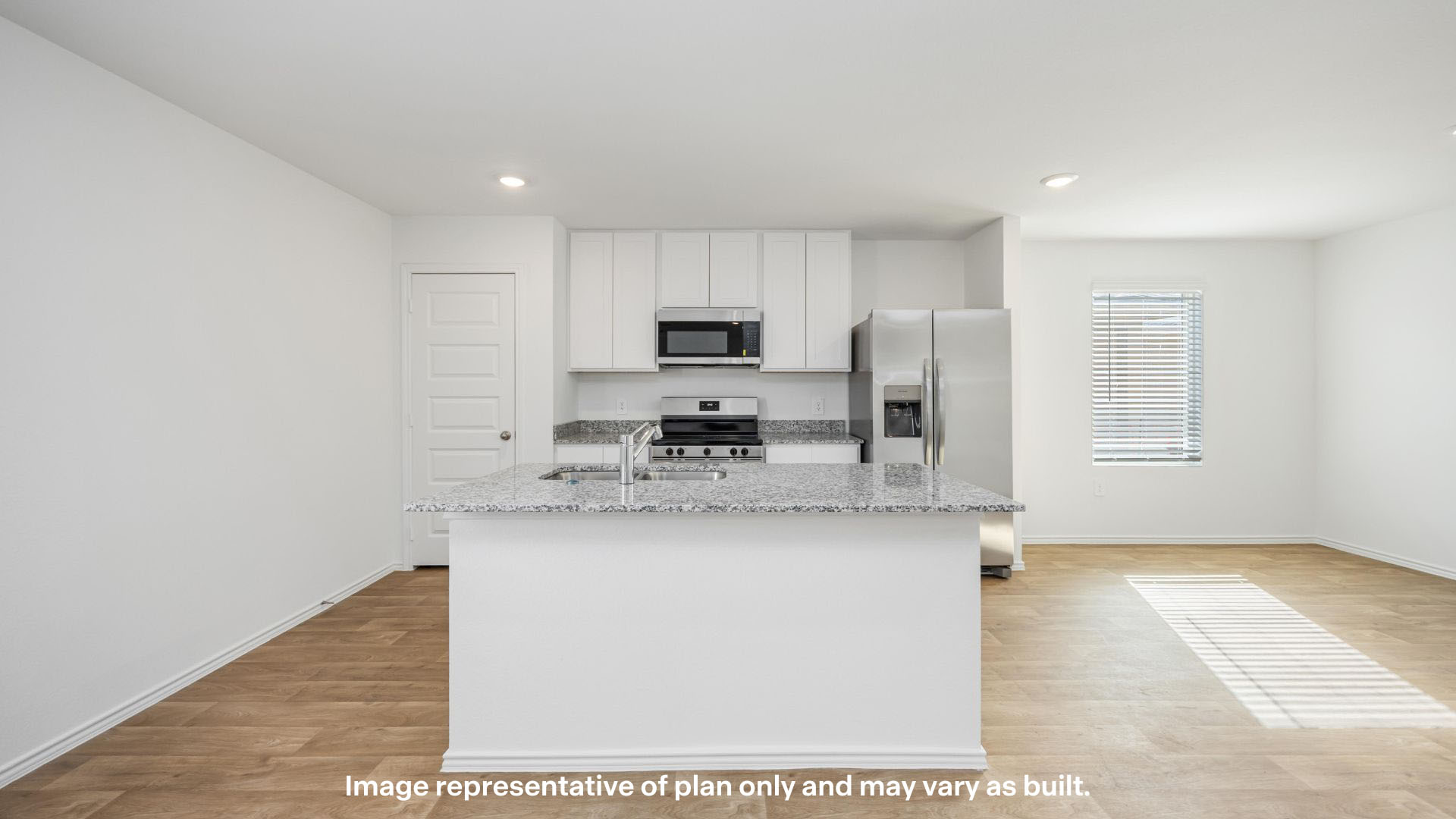 Open concept kitchen with stainless steel appliances, shaker style cabinets, and elevated finishes
