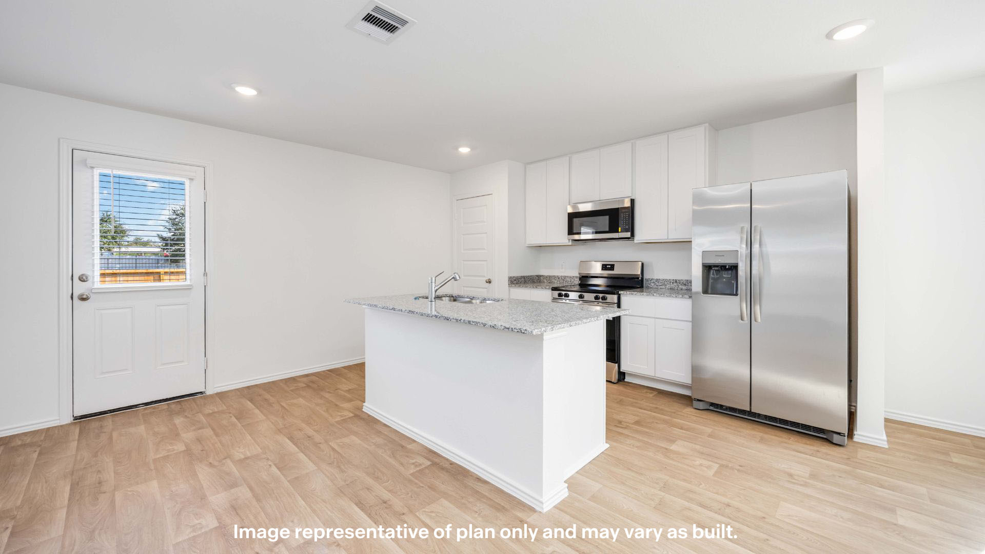 Spacious open concept kitchen with island and counter prep space