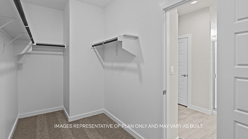 Primary walk-in closet with extra storage space