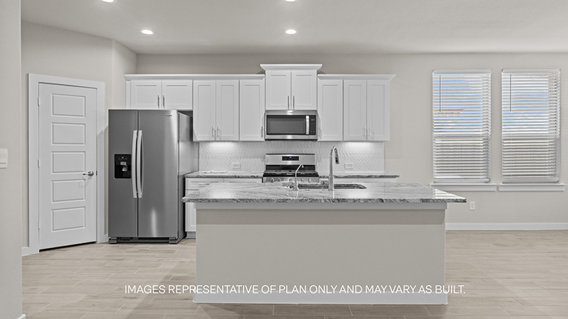 Spacious open concept kitchen with island and counter prep space
