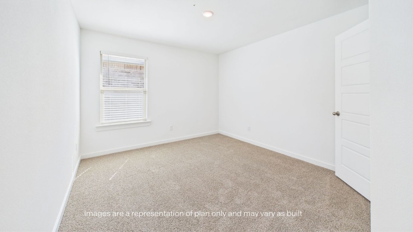 Guest bedroom with side window and plush carpet