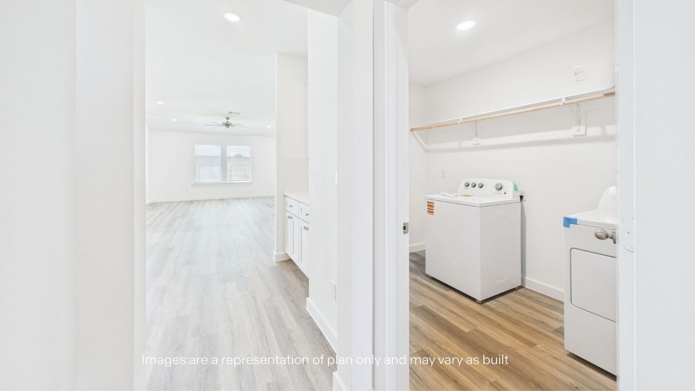 Hallway towards kitchen and living room area with laundry room storage room