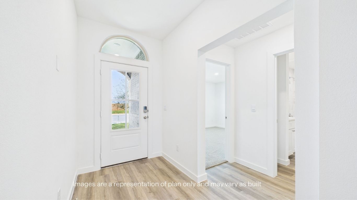 spacious foyer with guest rooms and restroom to the left