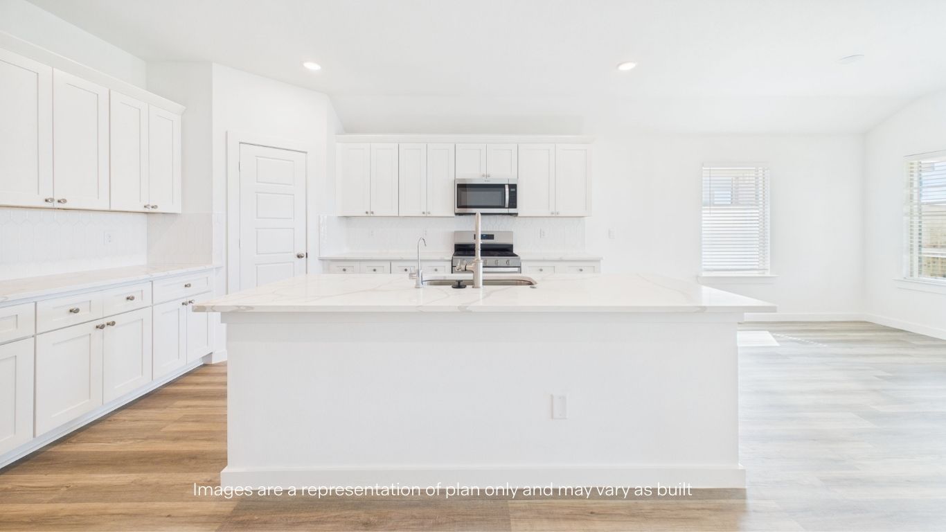 Spacious open concept kitchen with island and counter prep space