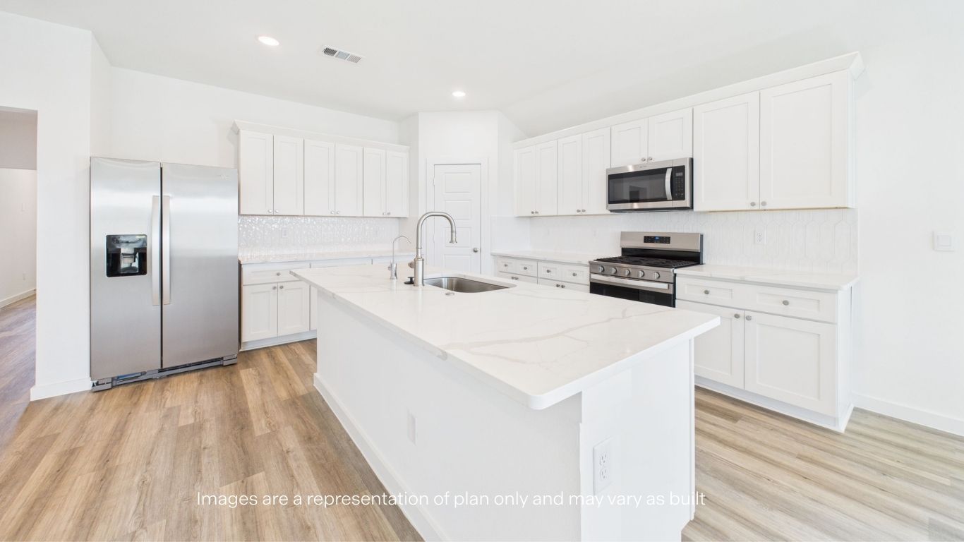 Spacious open concept kitchen with island and counter prep space