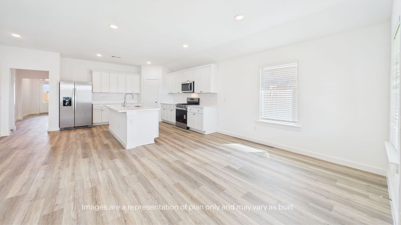 Open living and family room area with ample natural light