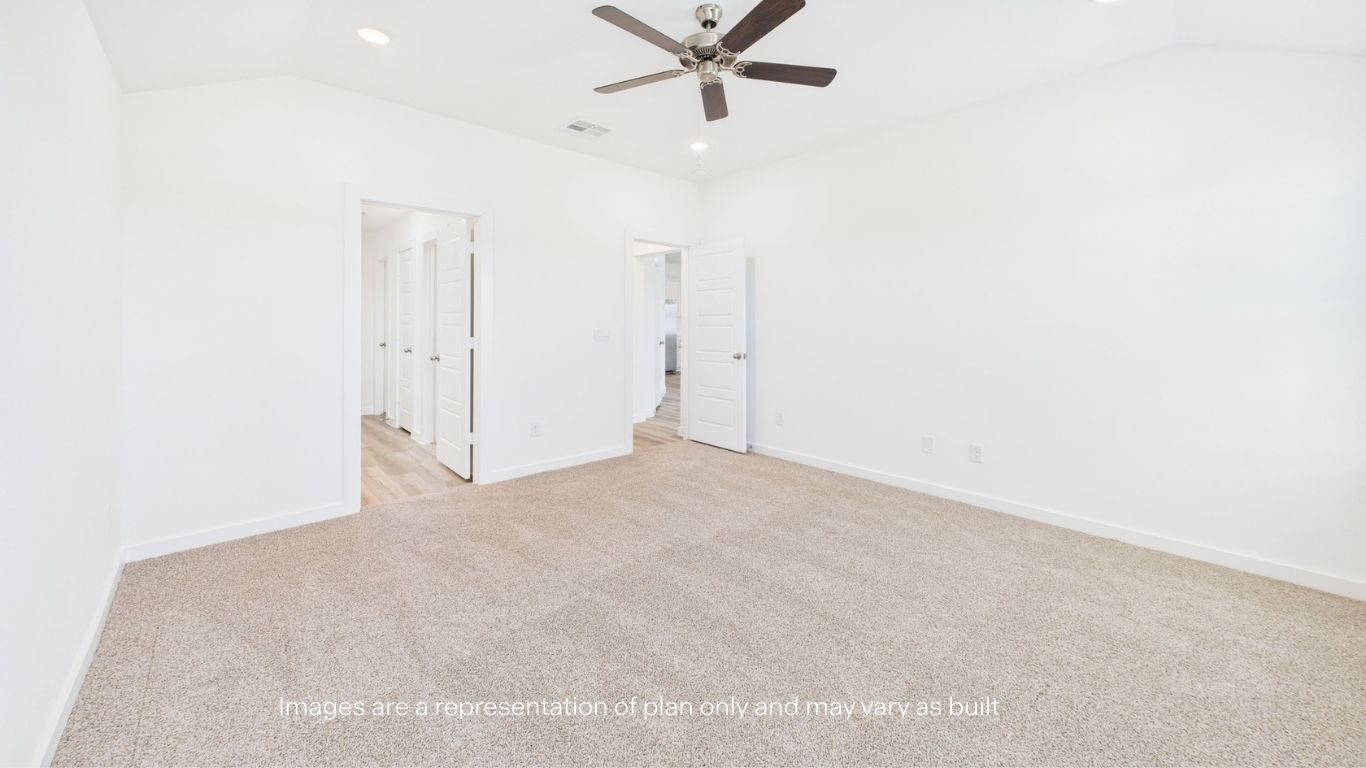 Primary bedroom with private attached bathroom and walk-in closet