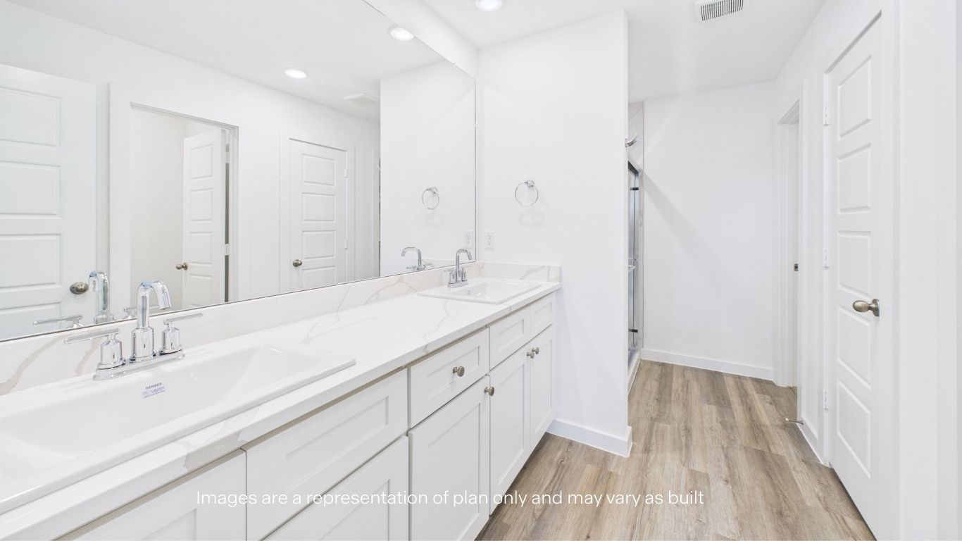 Primary bathroom with luxurious shower and built in storage